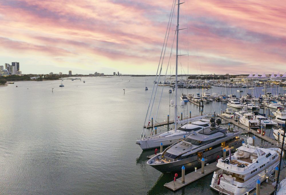 A bunch of boats are docked in a marina.