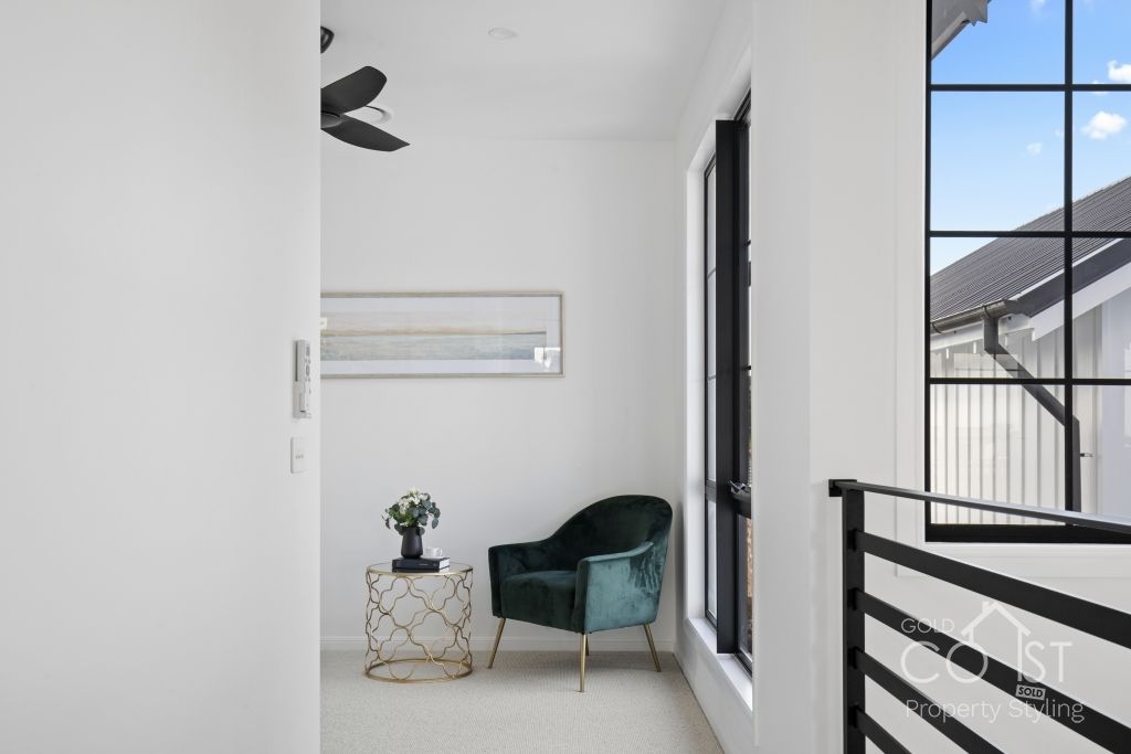 There is a chair and a table in the room.