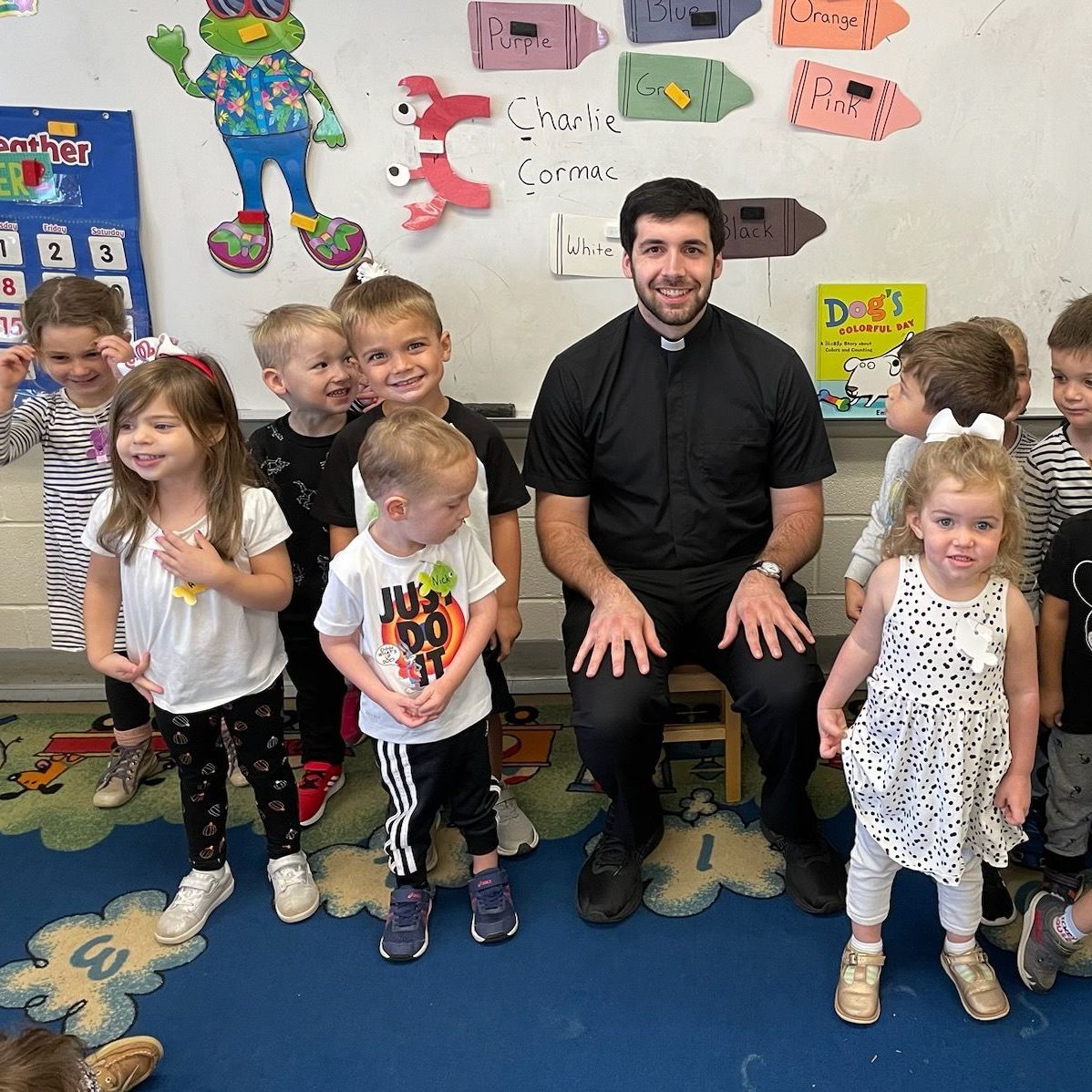 Father Kyle hanging out in PreK