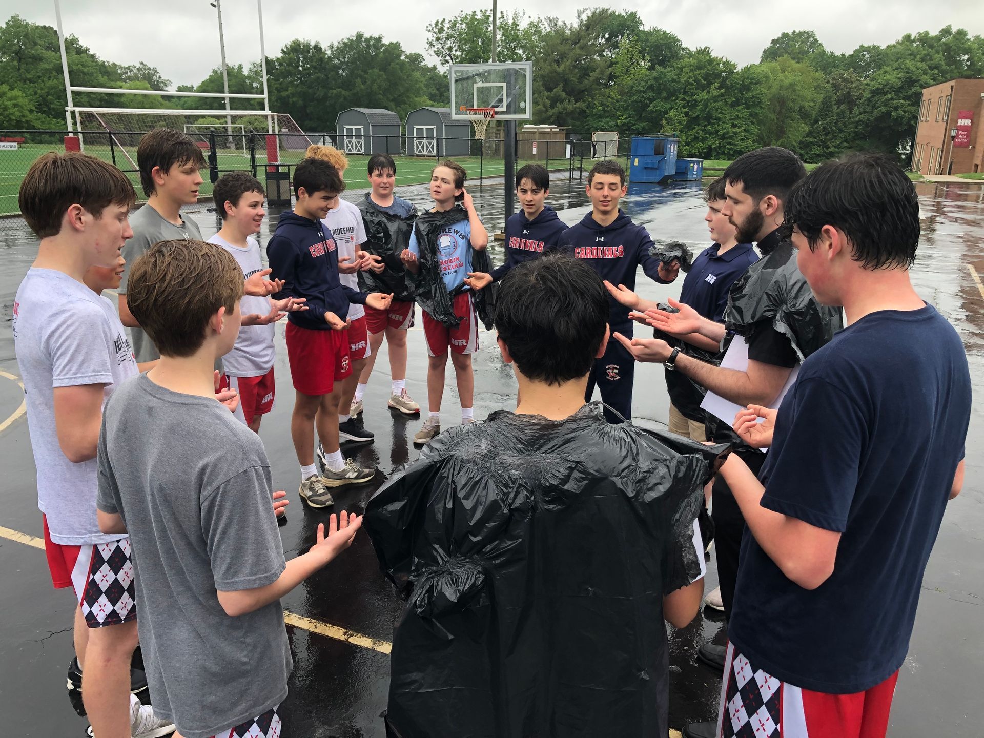 8th Grade Boys in Prayer with Father Kyle