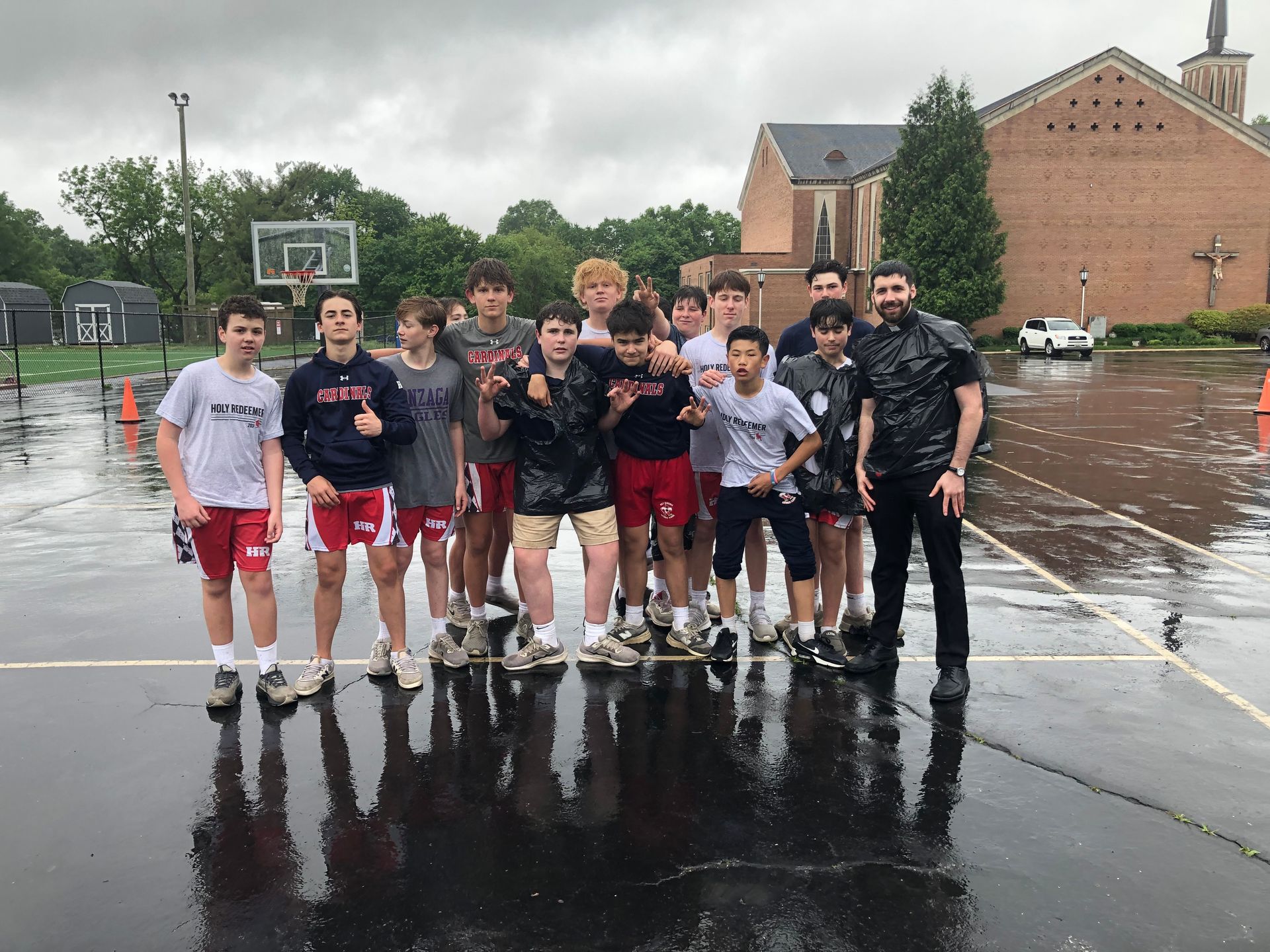Father Kyle Vance and his rainy day Basketball Team