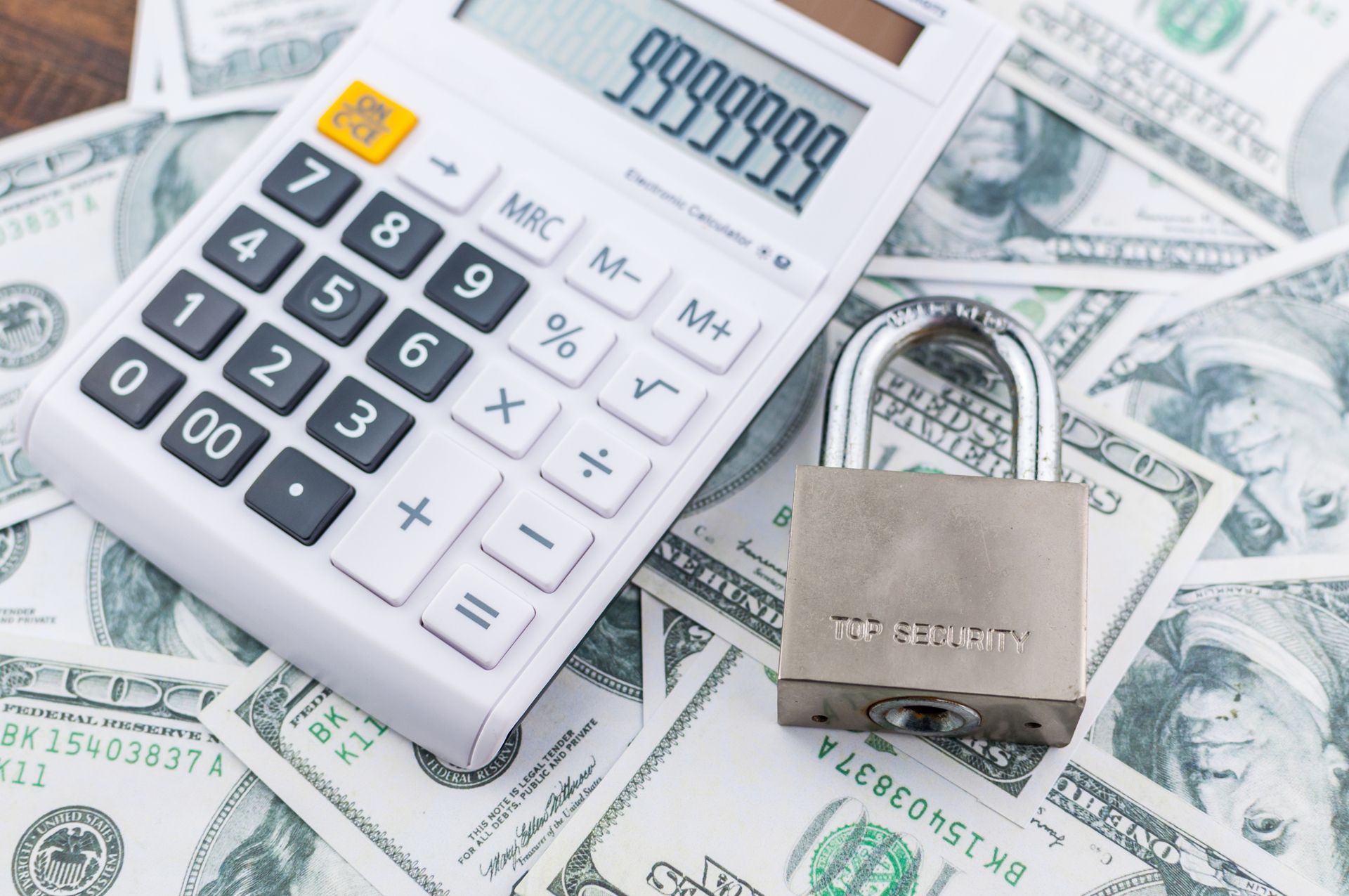 Two men in suits shaking hands, legal setting with gavel and scales in the background.
