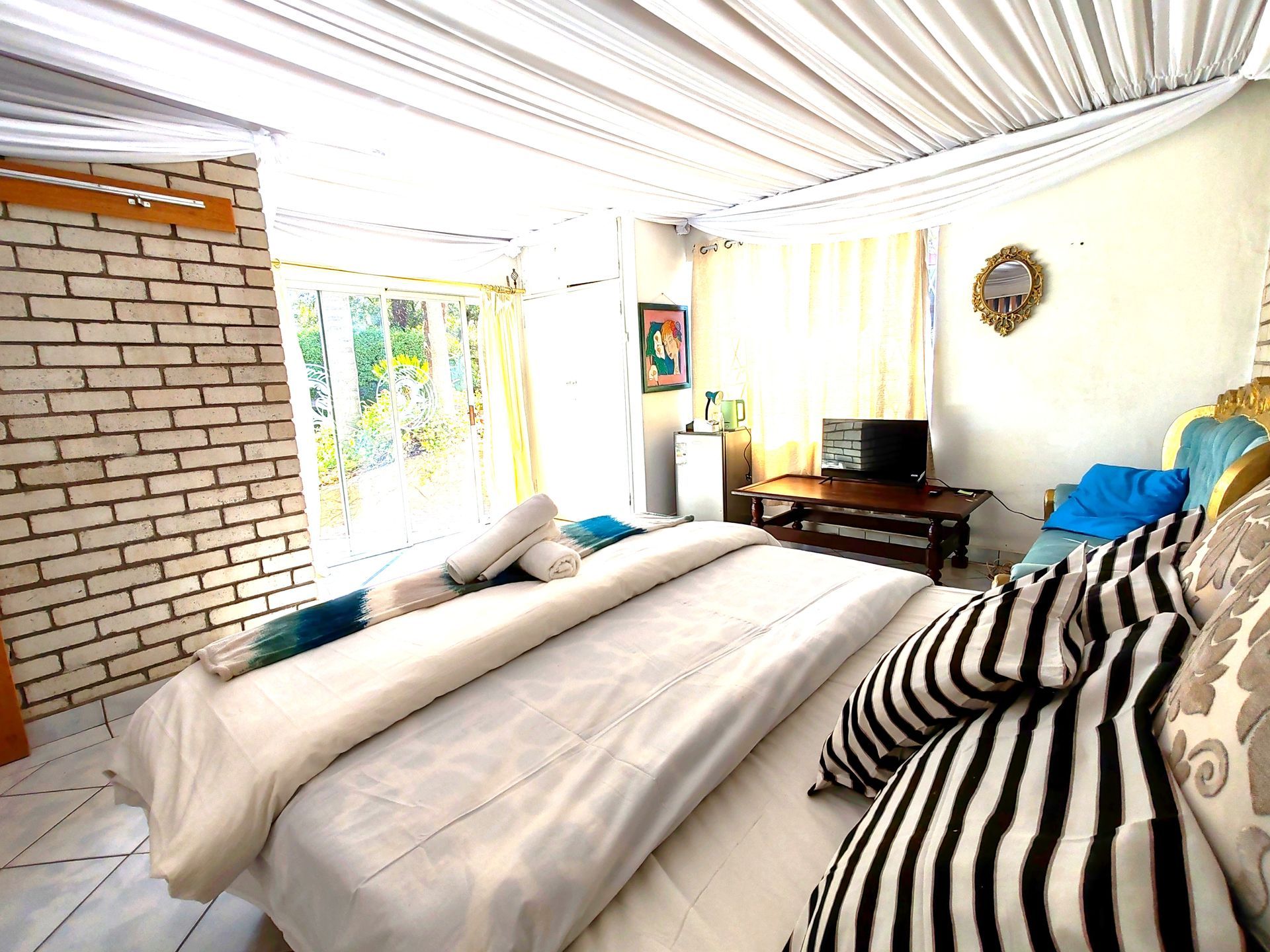 There is a large bed in the middle of the room.