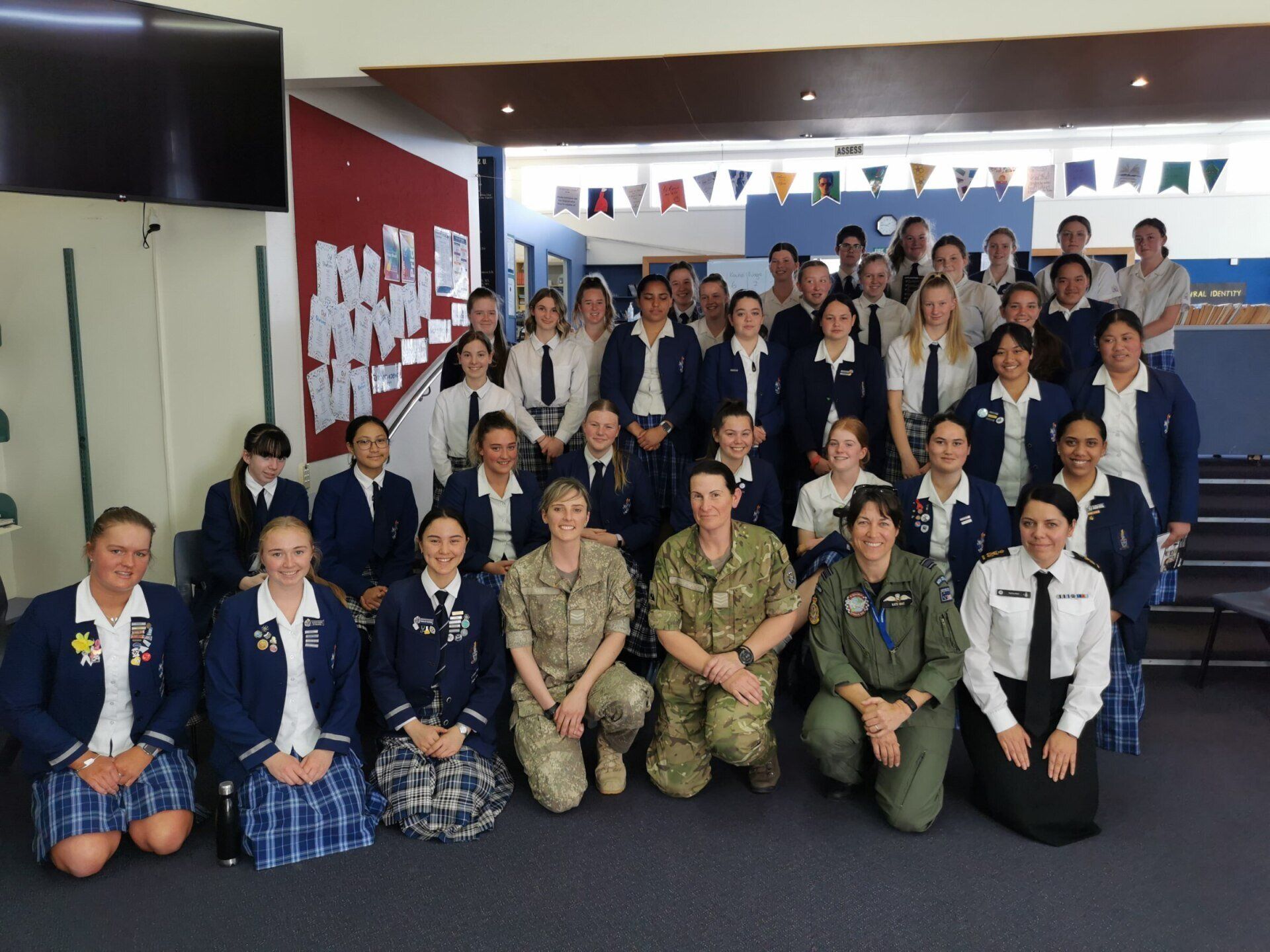 Timaru Girls Hig School | A group of people posing for a picture in a room