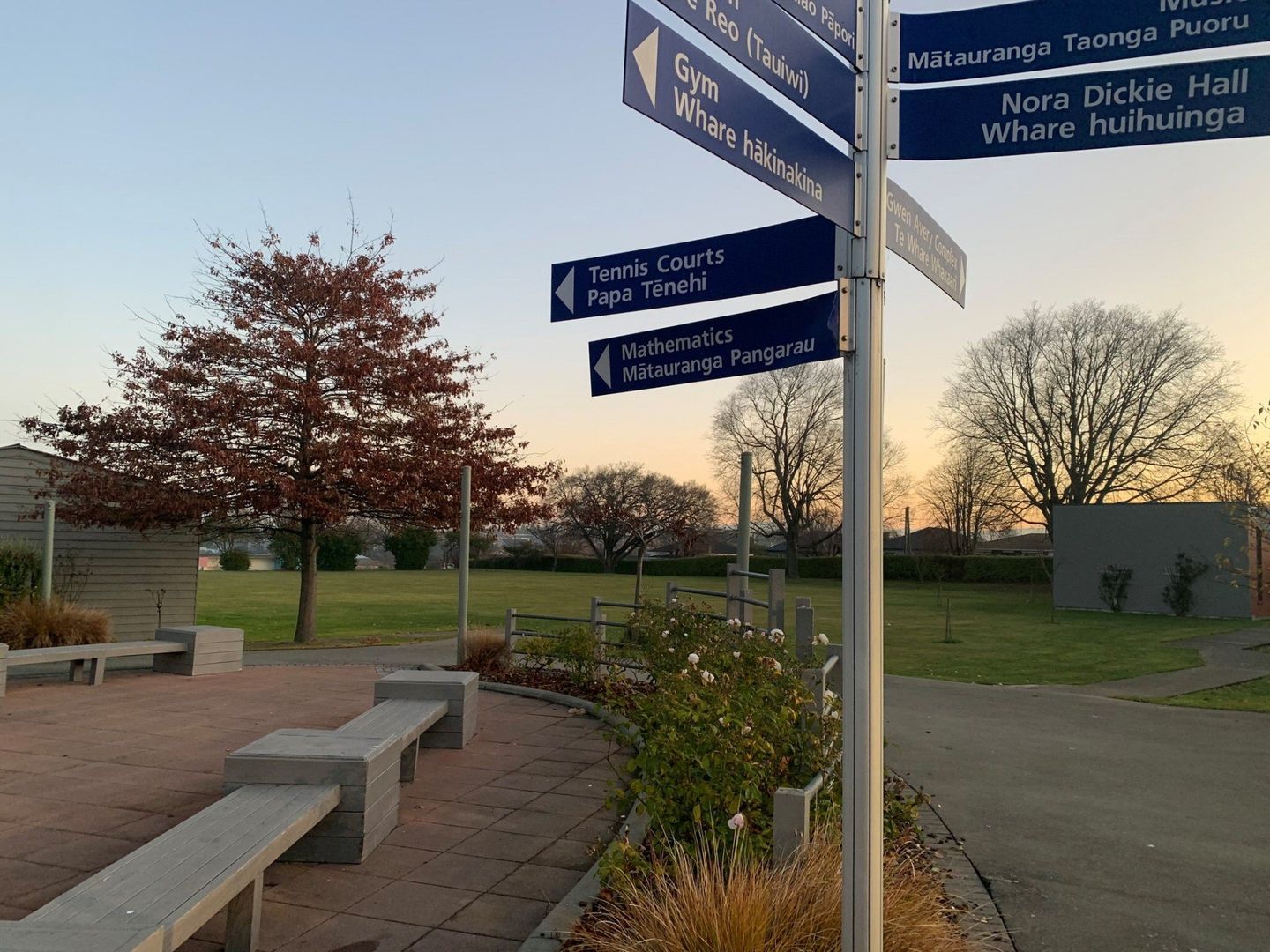 Timaru Girls Hig School | A sign in a park shows the directions to various places.