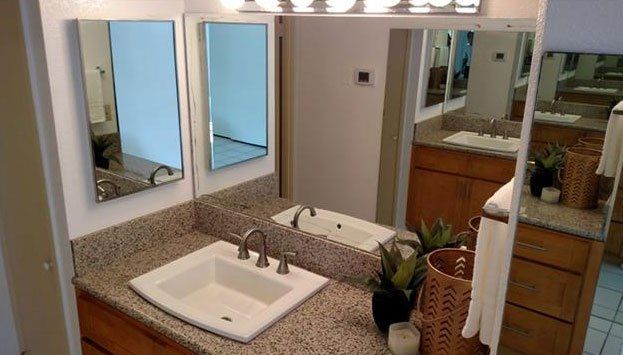 bathroom sink and mirrors