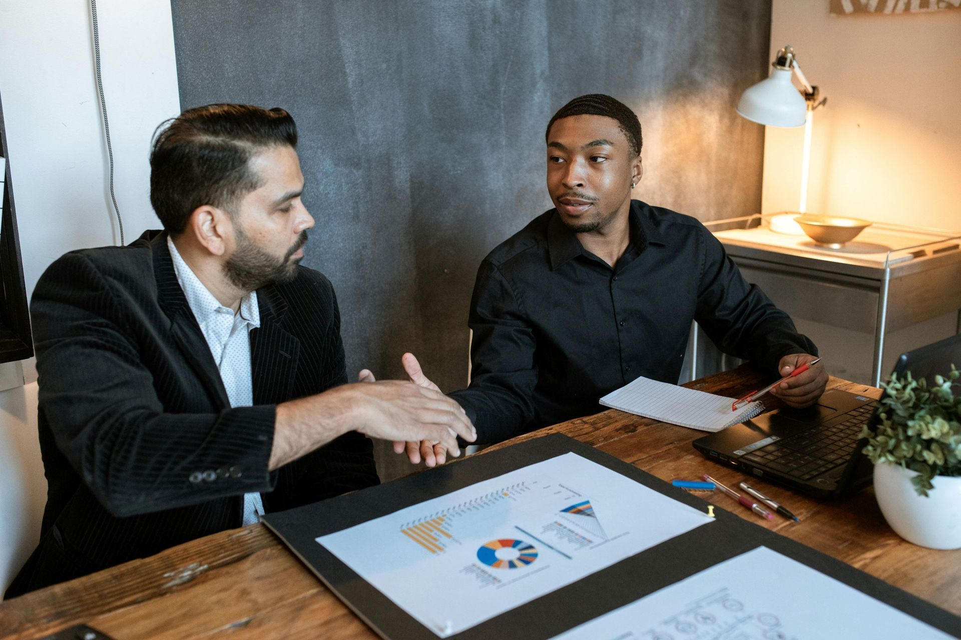 business owner with accountant: Ipswich accountants help business owners financial planning.