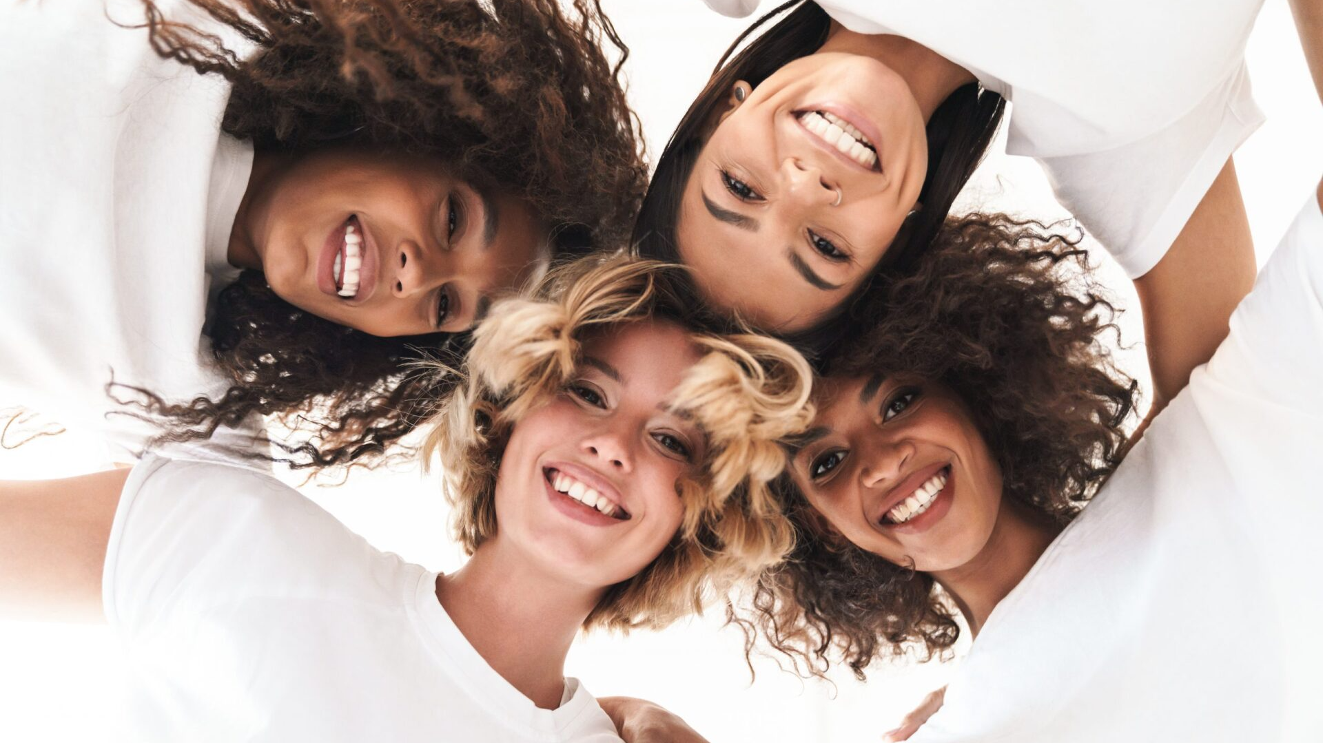 group of 4 diverse women with beautiful skin
