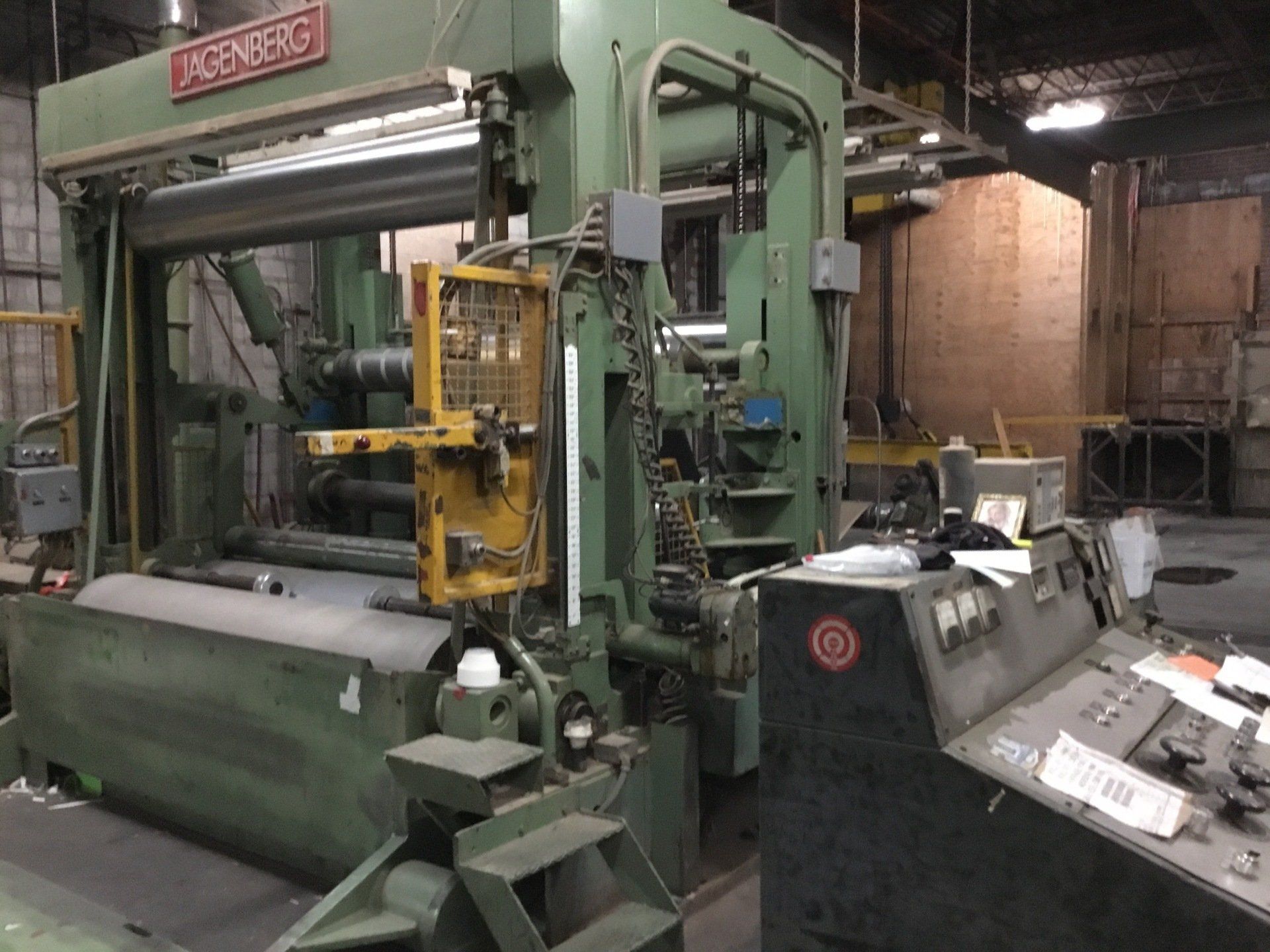 Heavy stamping press installation by Silver Lake Industrial in manufacturing facility.