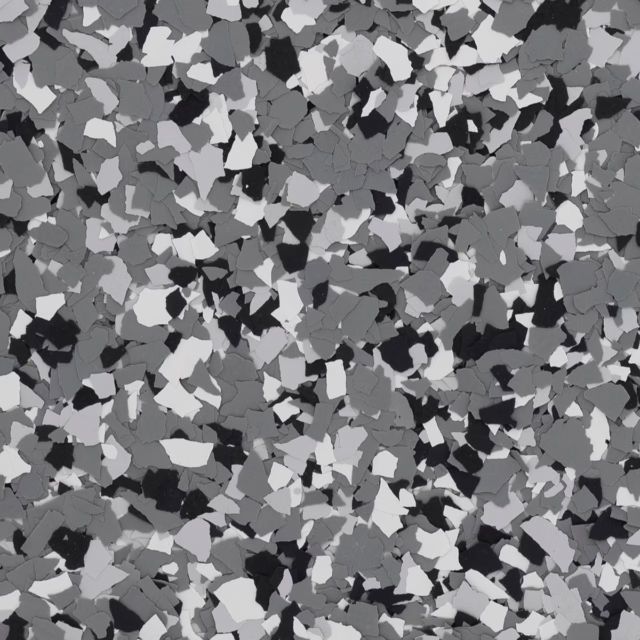 A close up of a gray , white , and black marble floor.