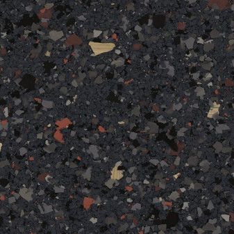 A close up of a black surface with a lot of small rocks on it