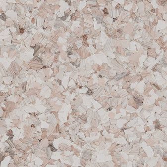 A close up of a pile of white and brown wood chips.