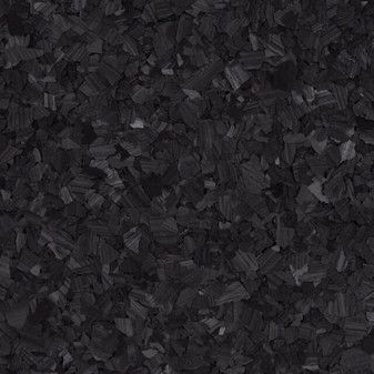 A close up of a pile of black wood chips.
