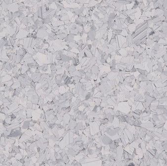 A close up of a piece of white rubber flooring.