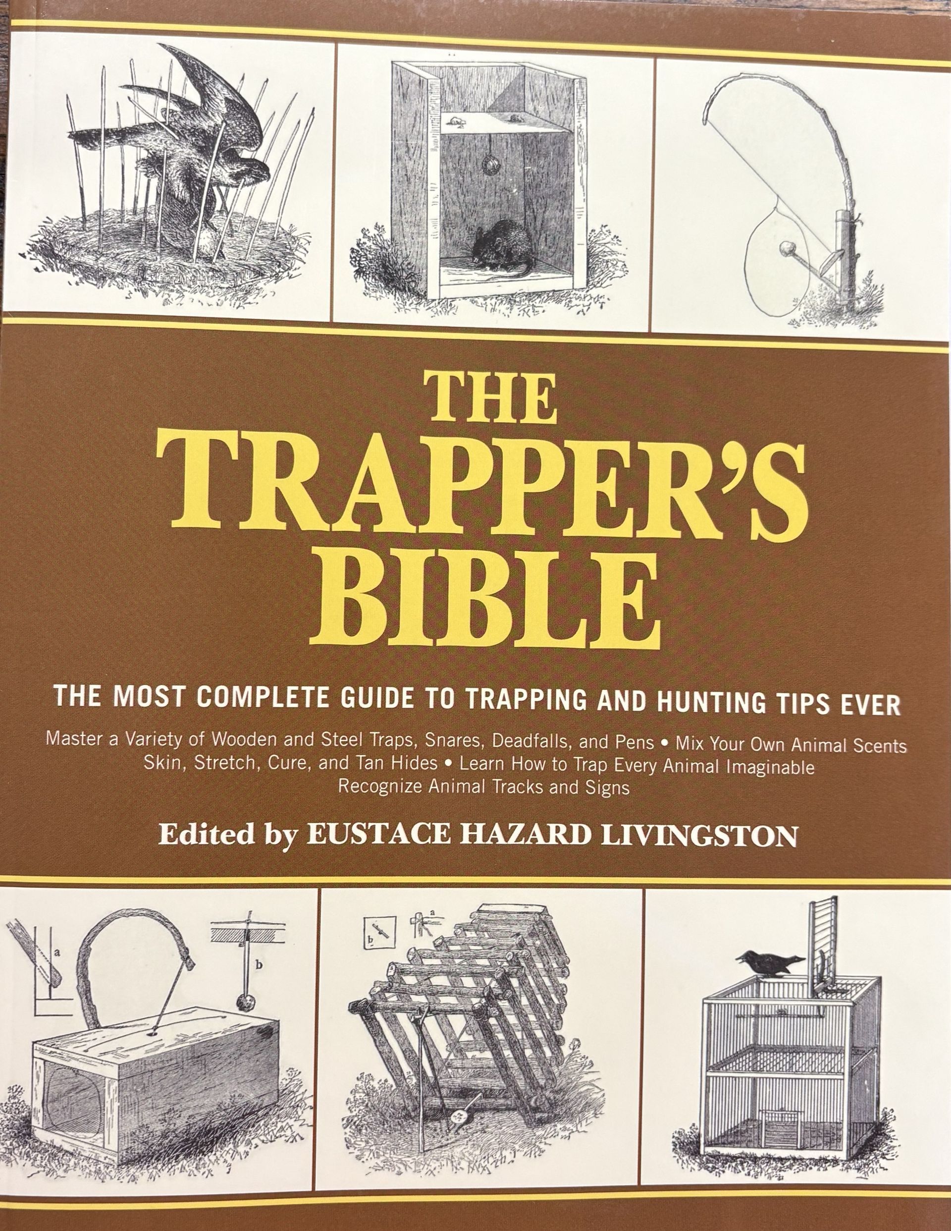 Cover displays different kinds of traps. "The Trapper’s Bible " edited by Eustace Hazard Livington.