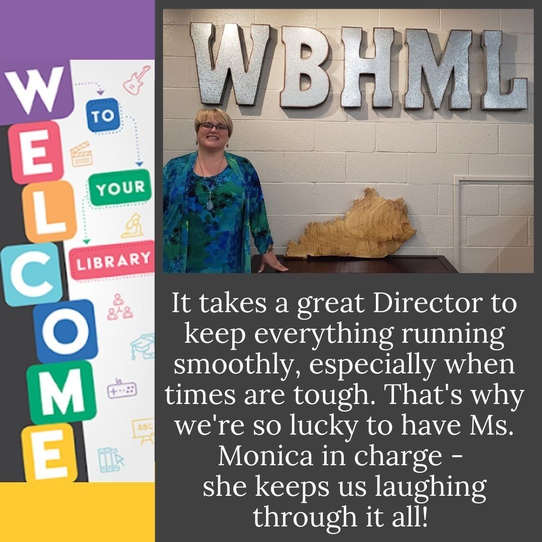 Woman standing by a sign that says 