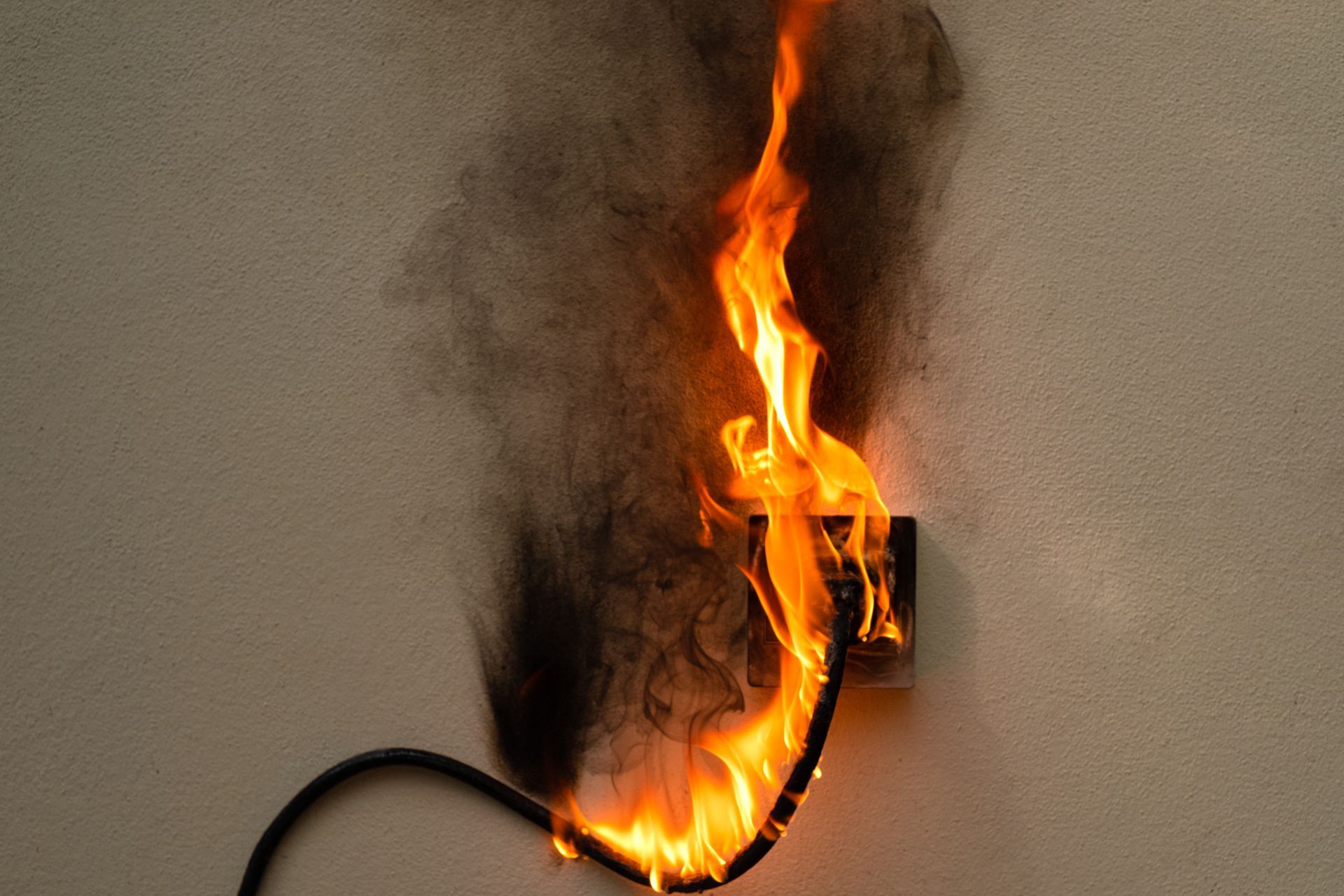 A fire is coming out of an electrical outlet