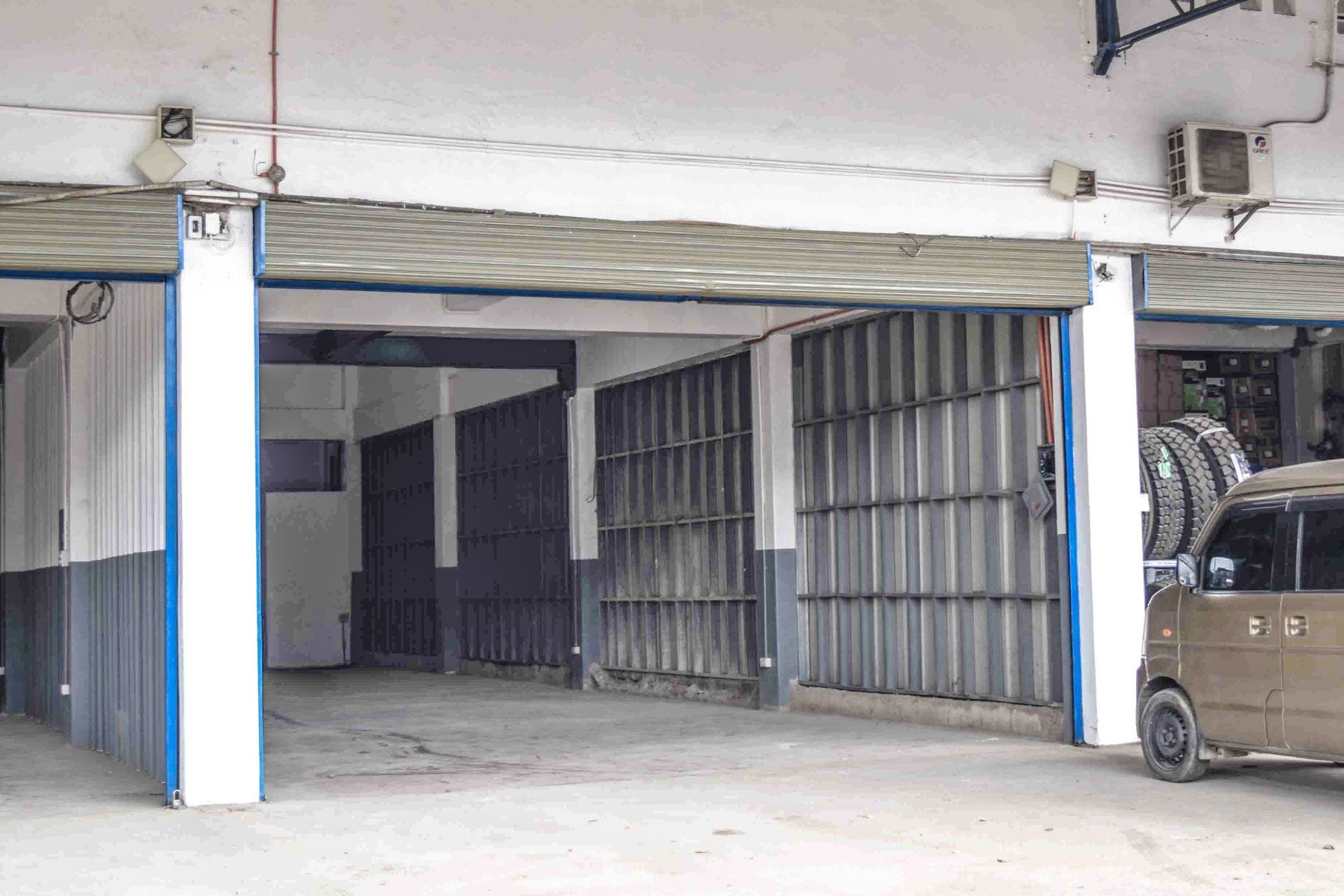 A car is parked in the garage of a building.