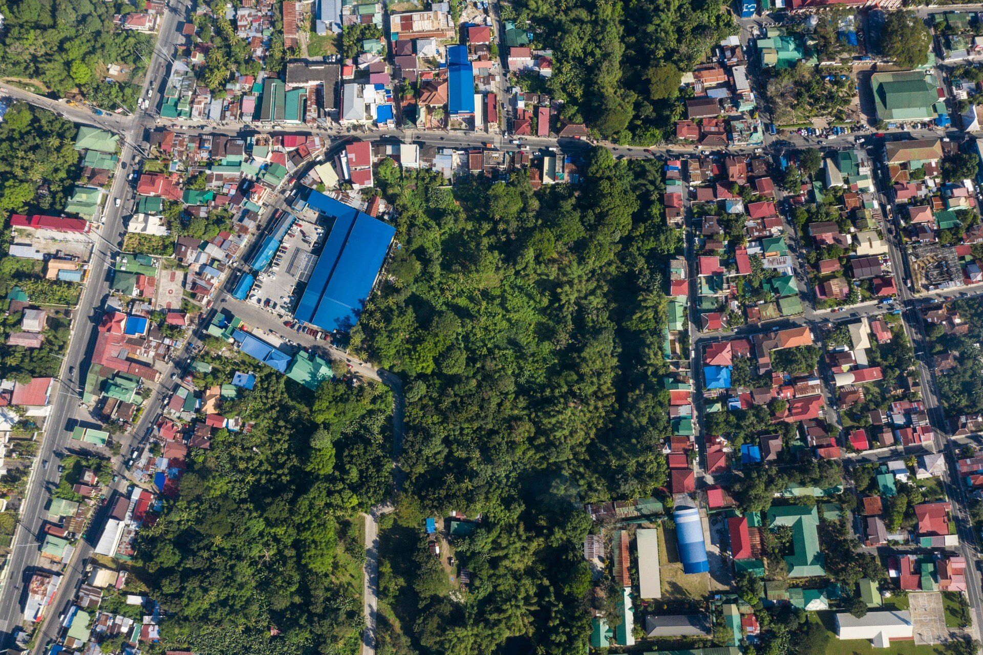 An aerial view of a city with lots of buildings and trees