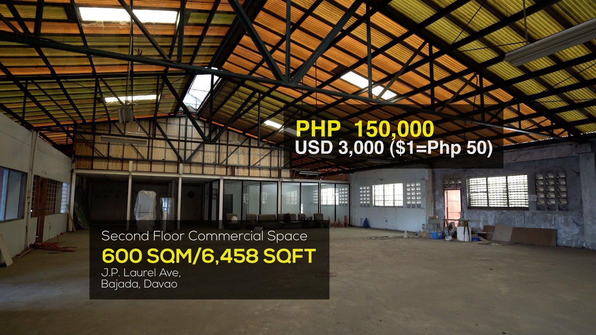 An empty building with a php 150,000 price tag on it