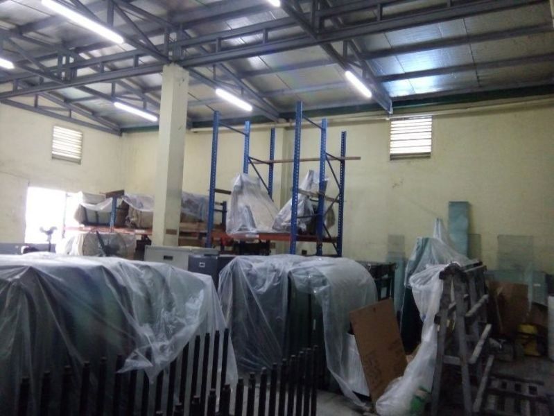 A warehouse filled with lots of plastic wrapped items