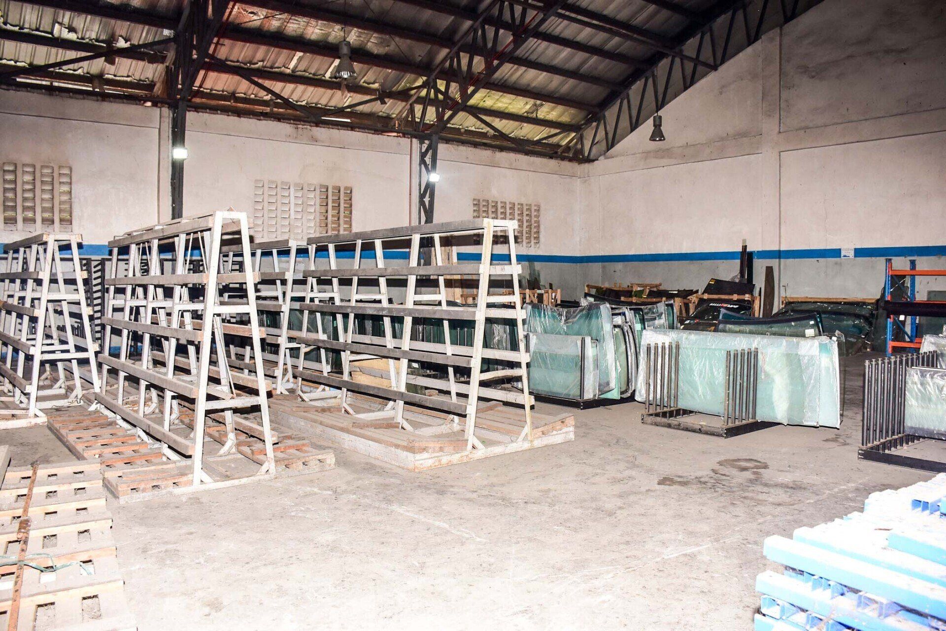 A warehouse filled with lots of shelves and pallets