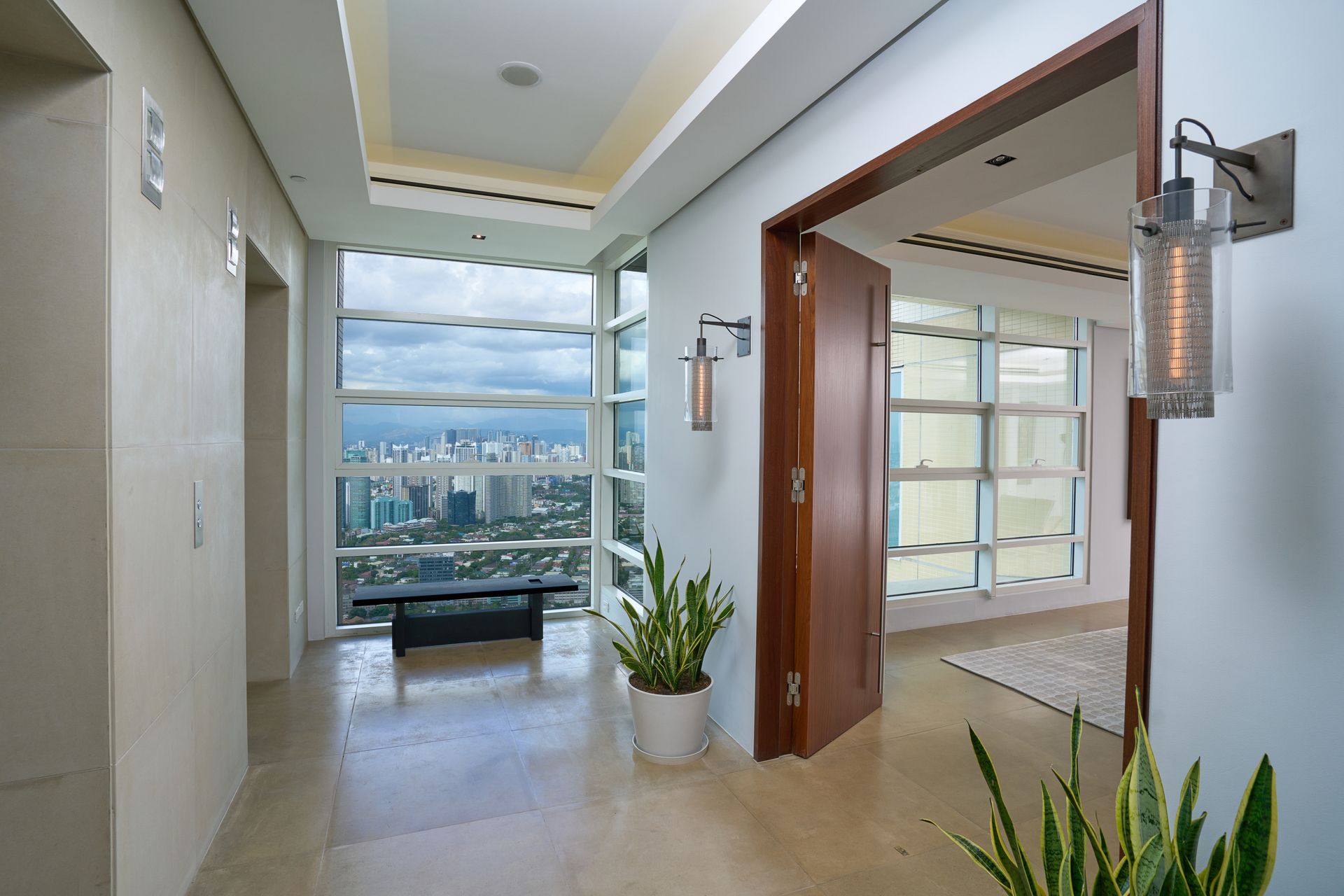A hallway in a building with a view of the city