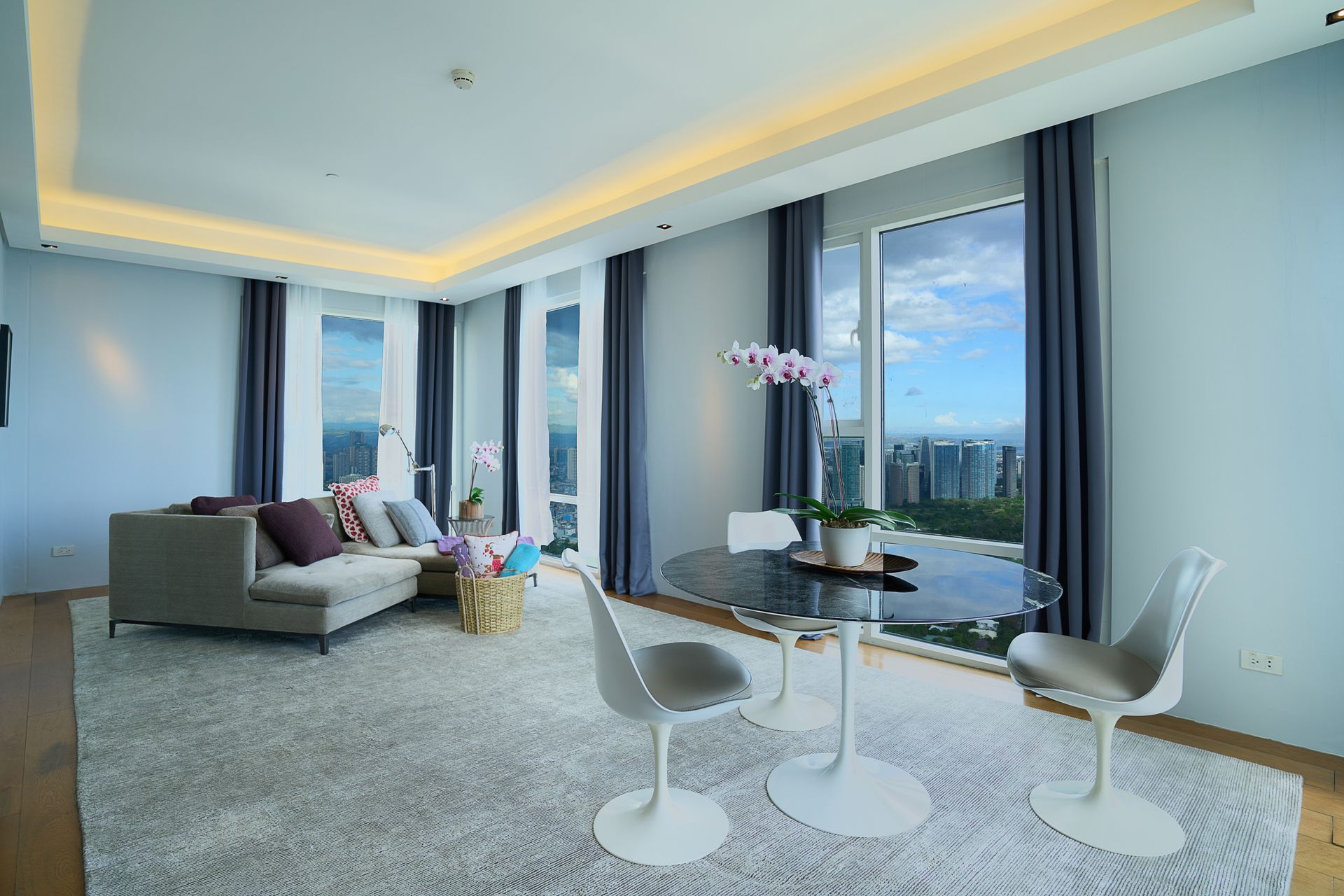 A living room with a table and chairs and a couch