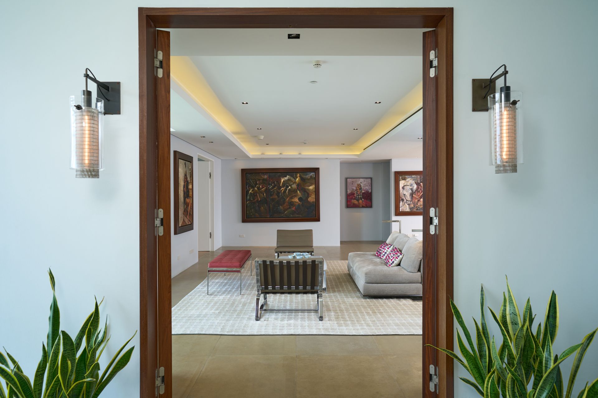 A view of a living room through a wooden door