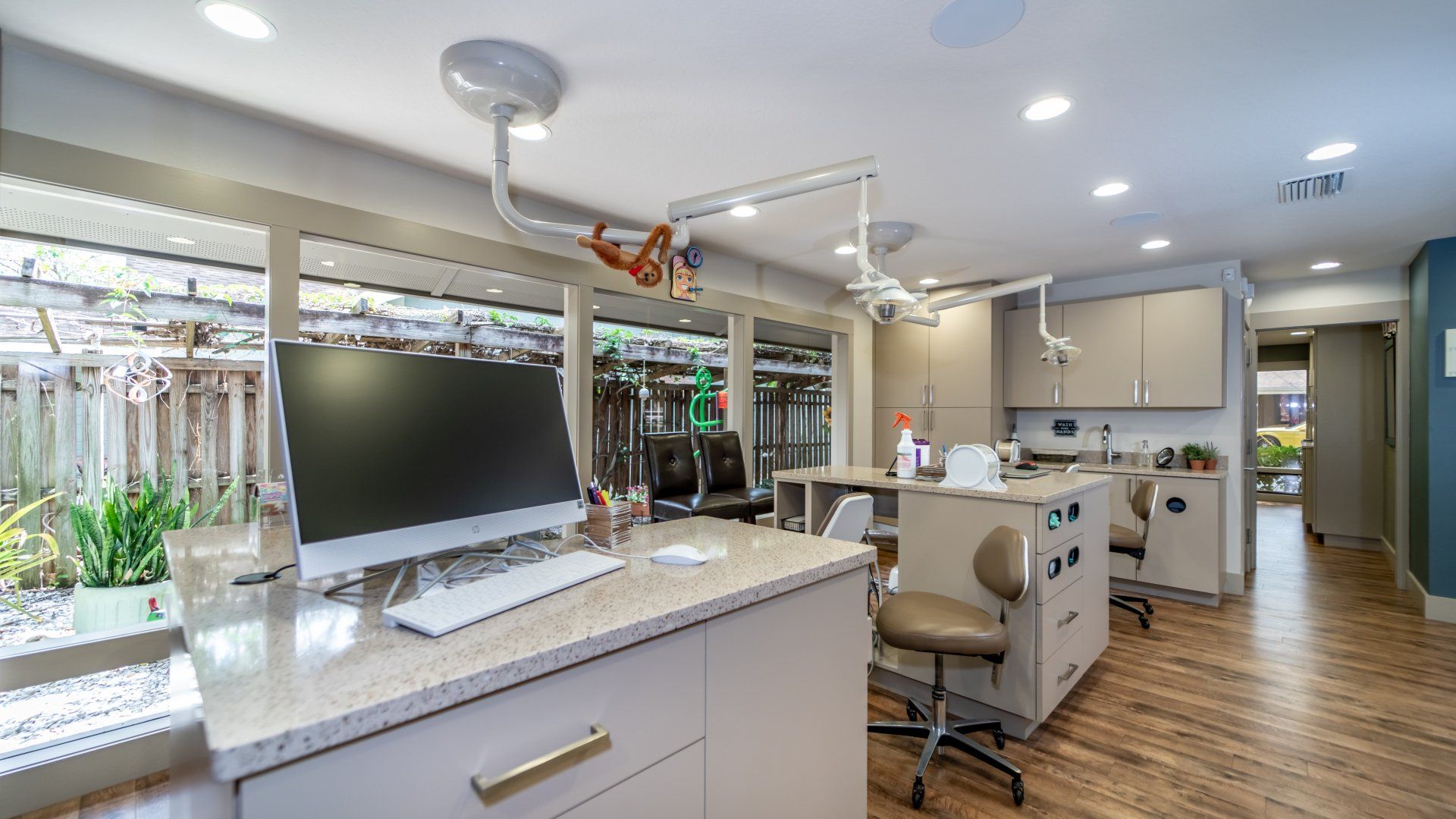 A dental office with a computer on a counter.