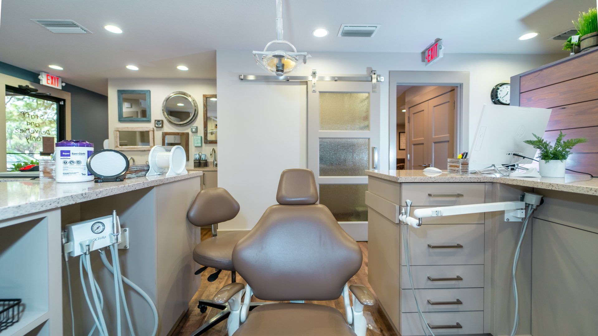 A dental office with a dental chair and a counter.