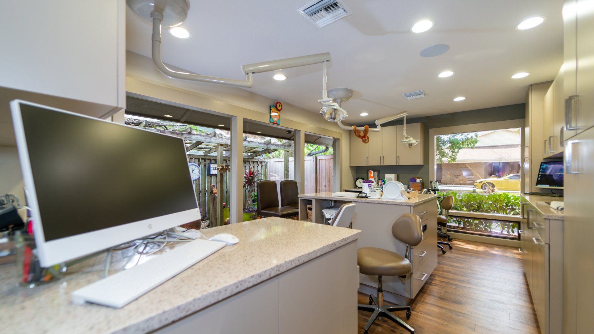 A computer is sitting on a counter in a dental office.