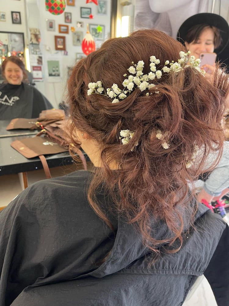 A Woman Is Getting Her Hair Done In A Salon And Has Baby 's Breath In Her Hair — Howard Street Hair Studio In Nambour, QLD
