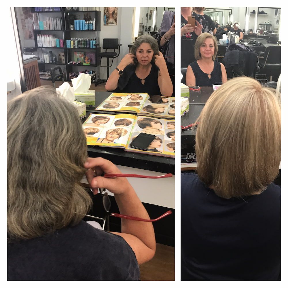 A Woman Is Getting Her Hair Done In A Salon — Howard Street Hair Studio In Nambour, QLD