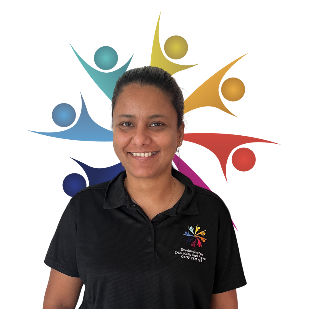 A woman in a black shirt is smiling in front of a group of people