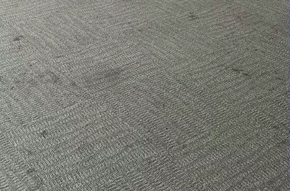 Before image of a dirty carpet in a commercial space, needing professional cleaning in Telford, PA.