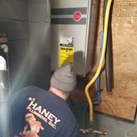 Kitchen — Man Fixing Pipes in Bloomington, IL