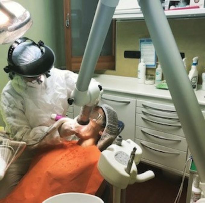 Dentist working with patient