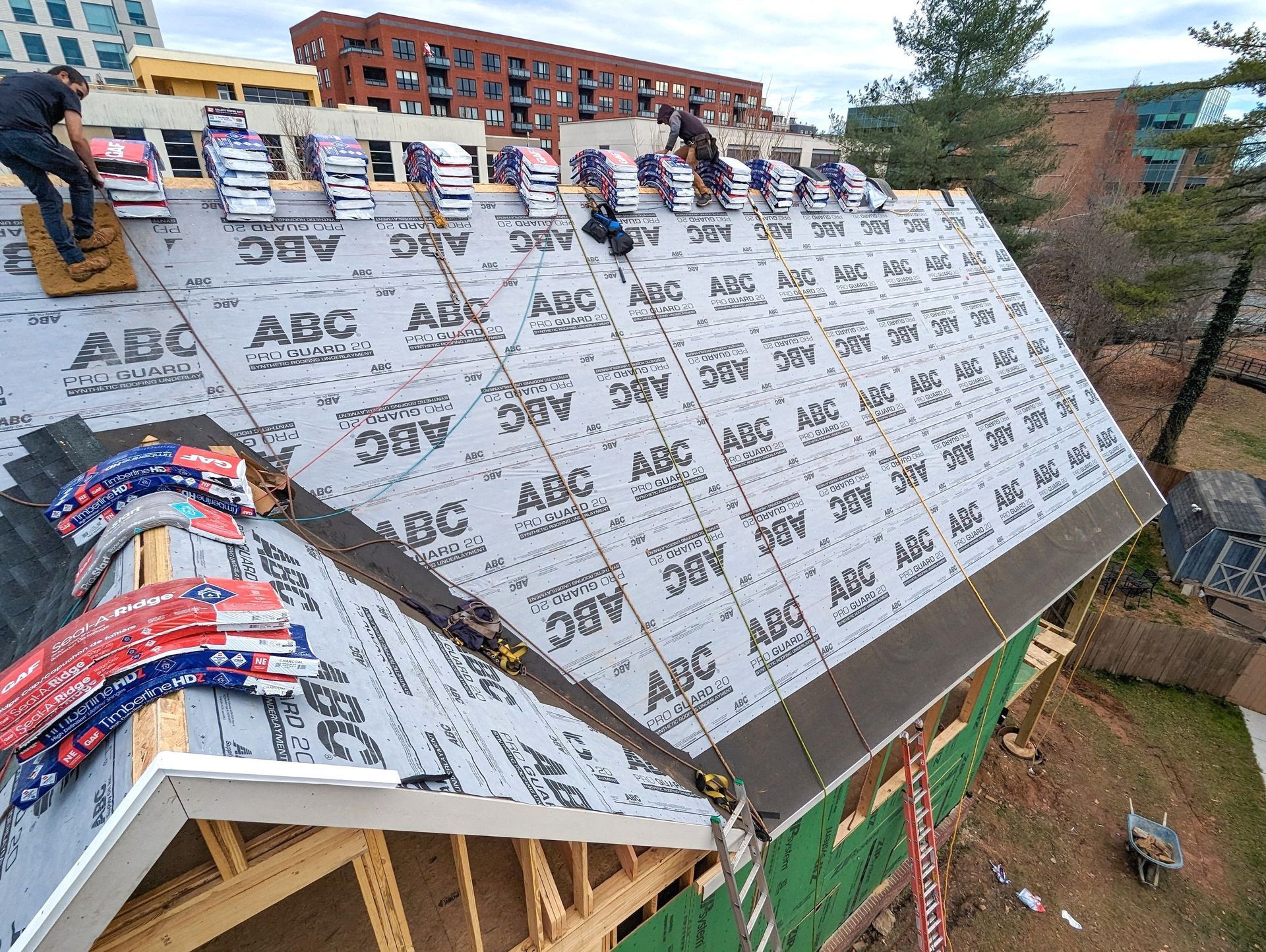 A group of people are working on a roof.