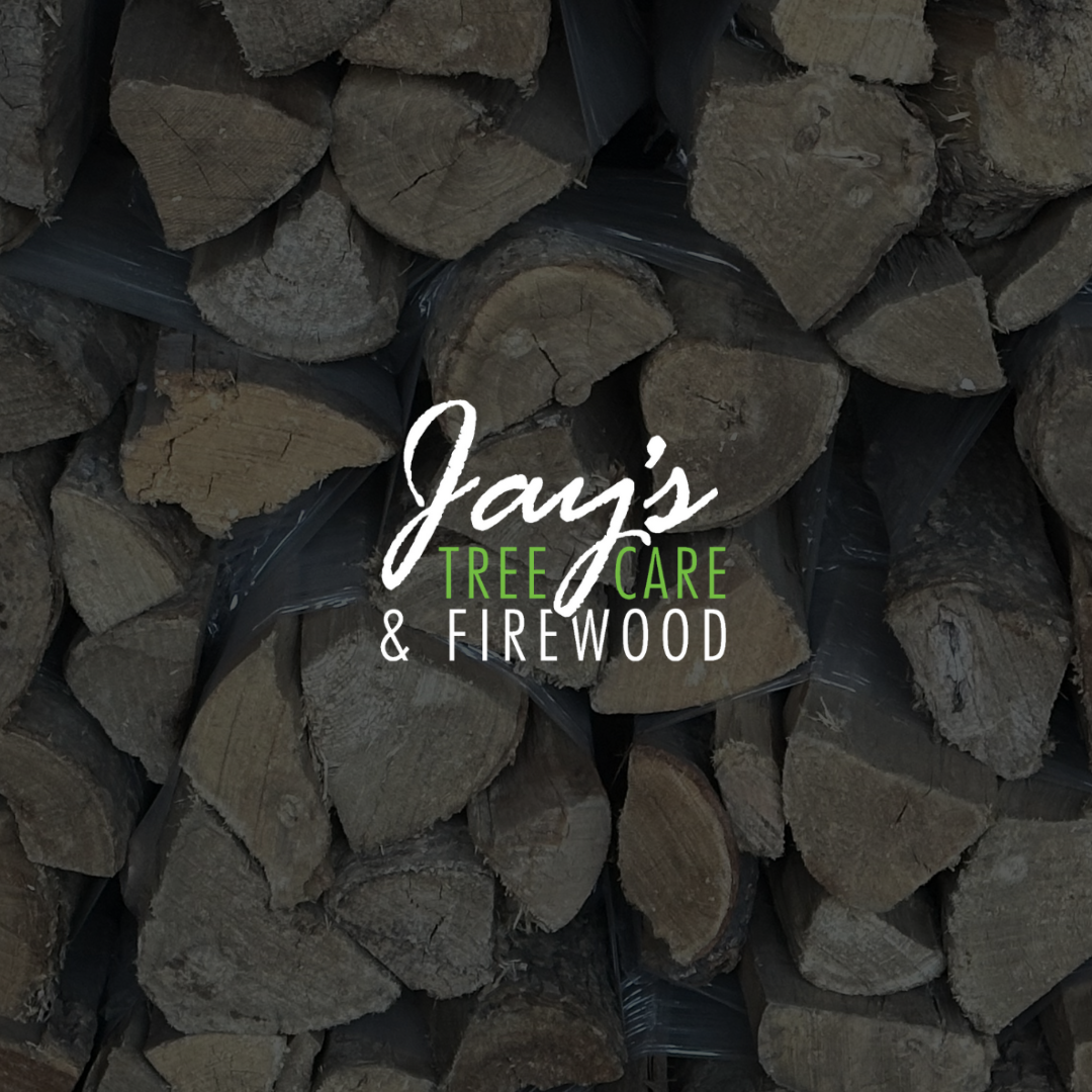 A pile of logs with jay 's tree care and firewood written on it