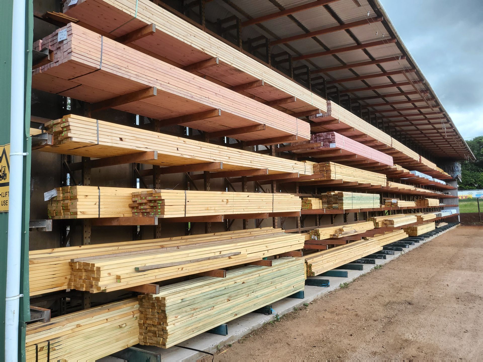 Bunch of Wooden Boards Are Stacked on Top of Each Other — Payless Timbers in Tolga, QLD