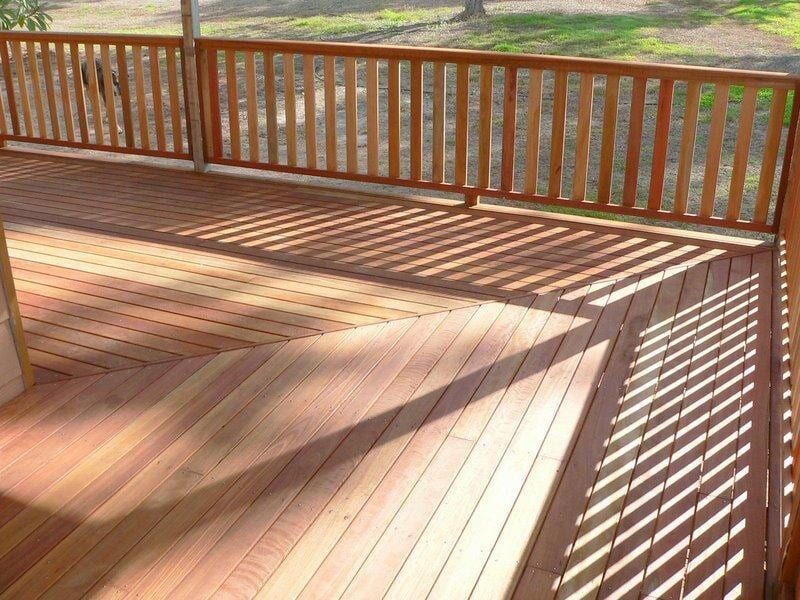 A Wooden Deck with A Wooden Railing and Shadows — Payless Timbers in Tolga, QLD