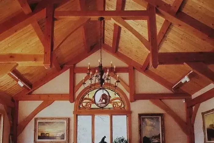 Room With Wooden Beams and a Chandelier Hanging From the Ceiling — Payless Timbers in Tolga, QLD