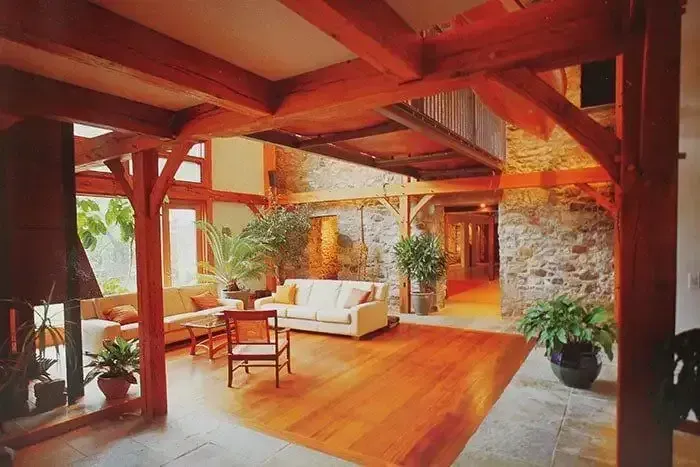 Living Room With a Couch and Chairs and a Fireplace — Payless Timbers in Tolga, QLD