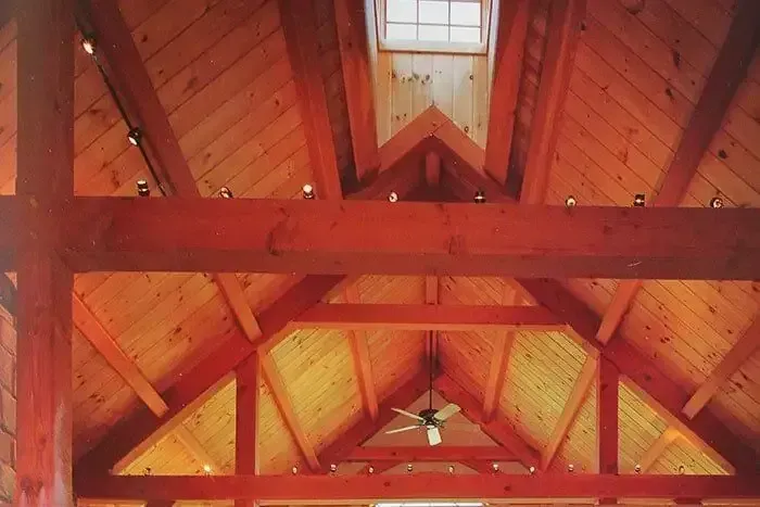 Wooden Ceiling With a Ceiling Fan and a Window — Payless Timbers in Port Douglas, QLD