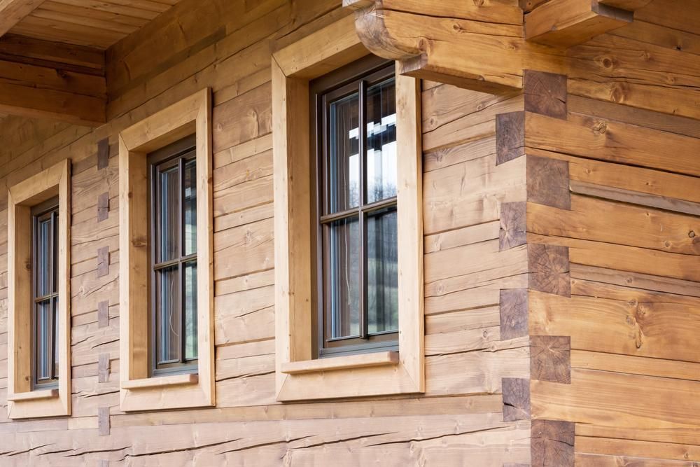 Wooden House With Three Windows on the Side of It — Payless Timbers in Tolga, QLD