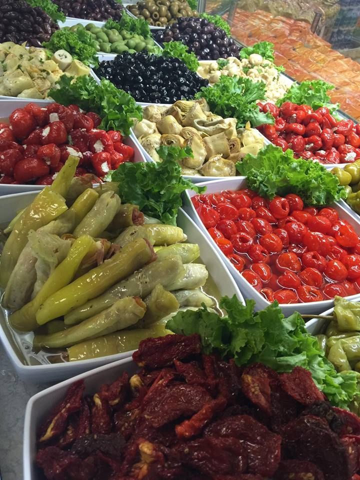 A variety of fruits and vegetables are displayed on a table