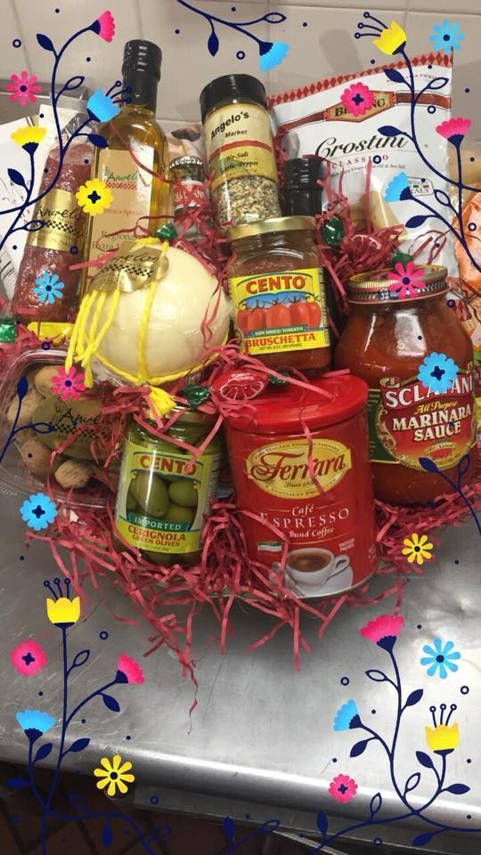 A basket filled with bottles and jars of food on a table.