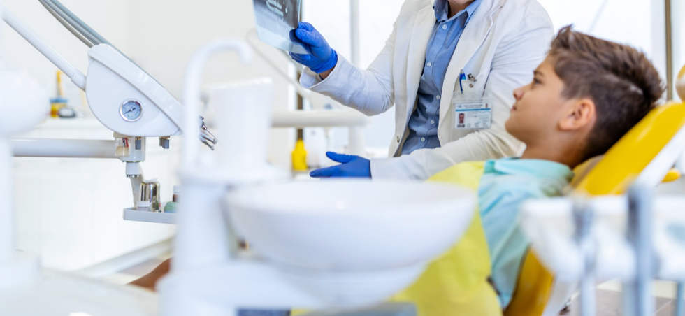 Doctor reviewing early treatment options for orthodontics