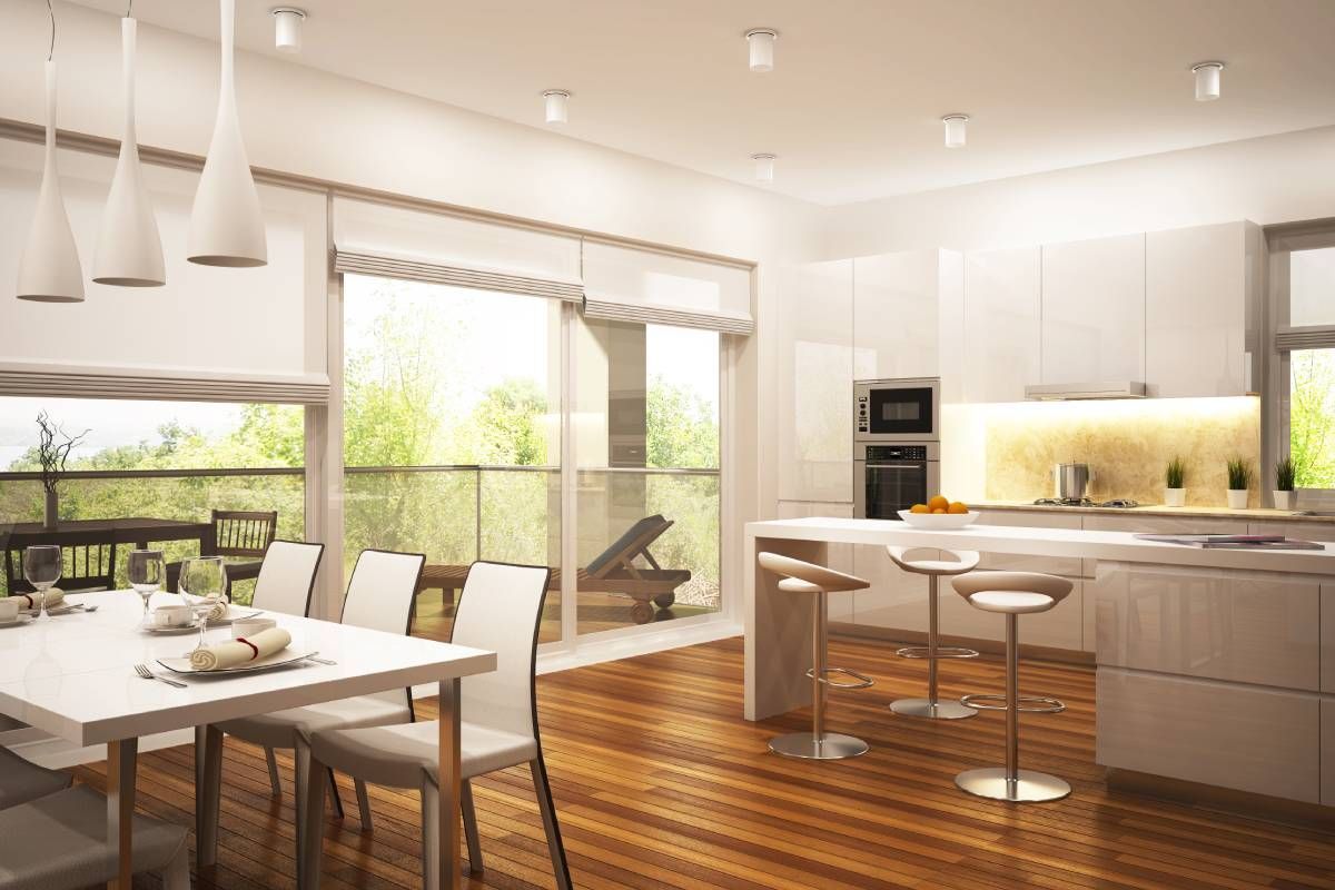 A luxury dining room and kitchen space with matching window shades at Beginning to End Interiors near Sarasota, Florida (FL)